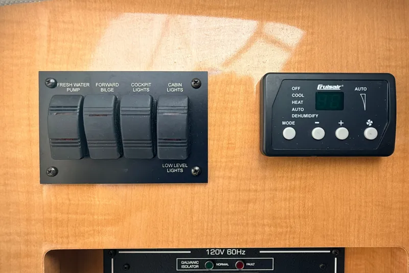 Slide: The Image of Control panel of a 2009 Four Winns 278 Vista boat with switches and digital display. - 32