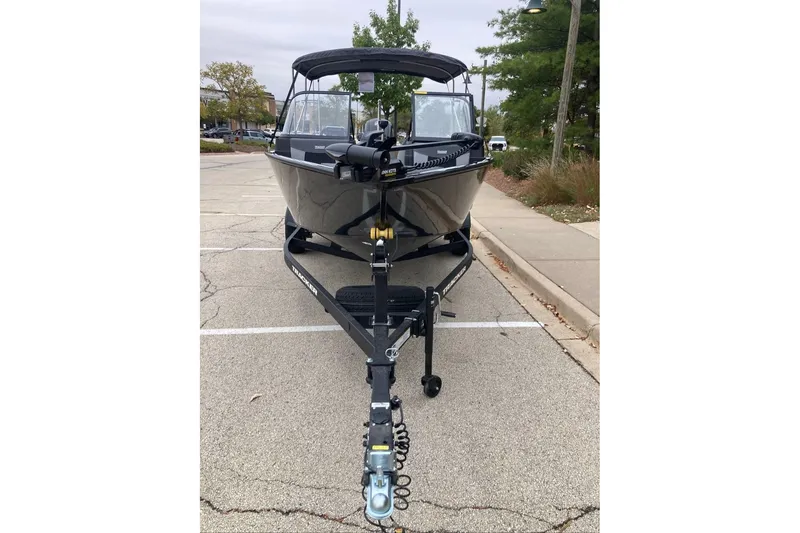 Slide: The Image of 2027 Tracker Targa V-18 Combo boat on trailer in parking lot. - 56
