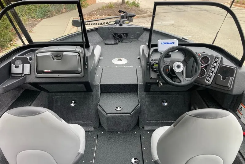 Slide: The Image of Interior view of 2027 Tracker Targa V-18 Combo boat with steering wheel and seating. - 57