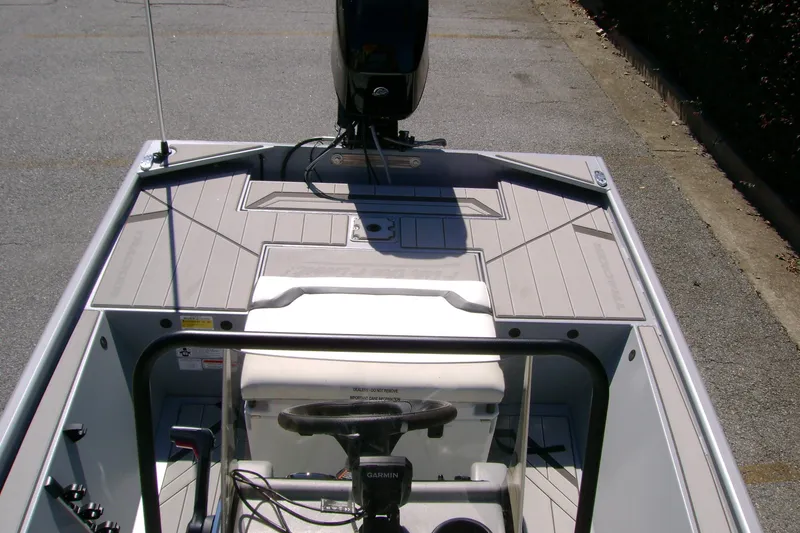 Slide: The Image of 2027 Tracker Bass Tracker Classic CC boat interior with steering wheel and control panel. - 14