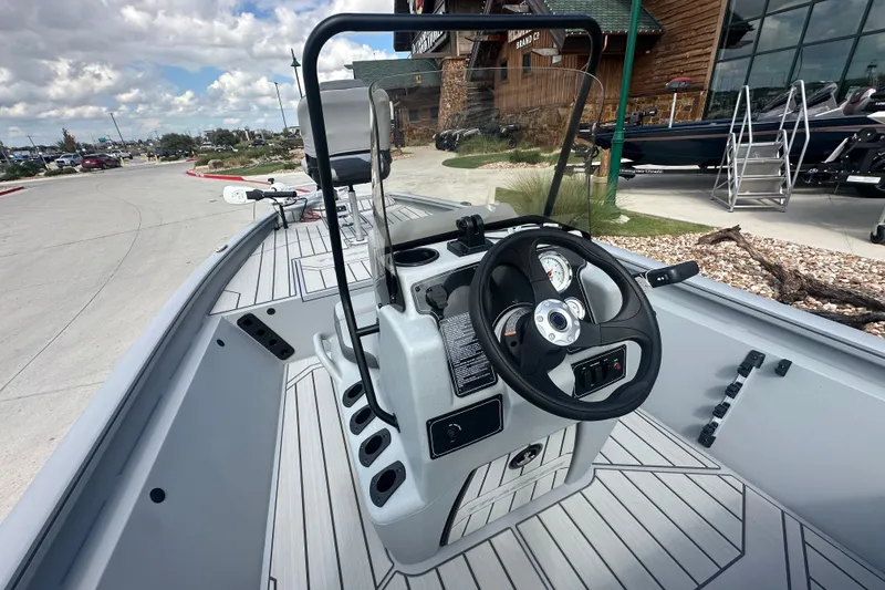 Slide: The Image of 2027 Tracker Bass Tracker 175 CC boat interior with steering wheel and controls. - 24