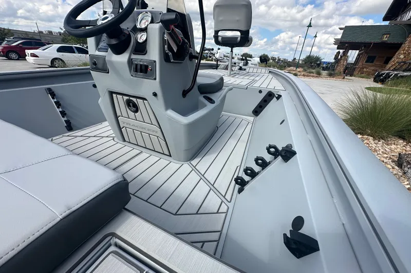 Slide: The Image of 2027 Tracker Bass Tracker 175 CC boat interior with steering console and seating. - 25