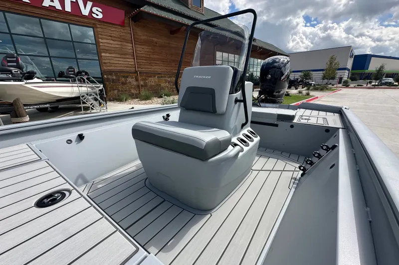Slide: The Image of 2027 Tracker Bass Tracker 175 CC boat with center console, displayed outdoors. - 21