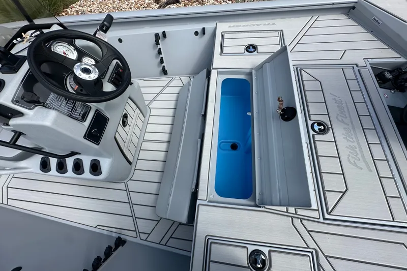 Slide: The Image of 2027 Tracker Bass Tracker 175 CC boat interior with steering console and storage compartments. - 23