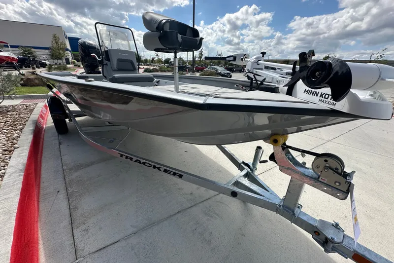 The Image of 2027 Tracker Bass Tracker 175 CC boat on trailer under cloudy sky. - 0