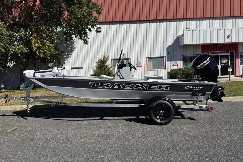 Slide: The Image of 2027 Tracker Bass Tracker Classic CC boat on trailer, parked outdoors. - 16