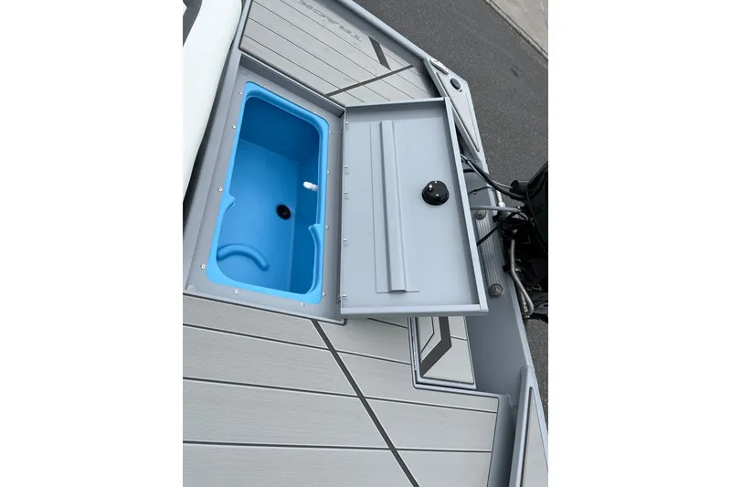 Slide: The Image of 2027 Tracker Bass Tracker Classic CC boat with open storage compartment on deck. - 13