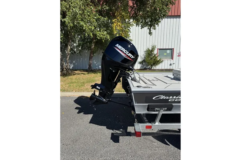 Slide: The Image of 2027 Tracker Bass Tracker Classic CC boat with Mercury outboard motor on trailer. - 19