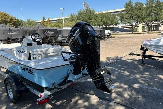 Slide: The Image of 2027 Mako Pro Skiff 15 CC boat with Mercury outboard motor on trailer. - 9