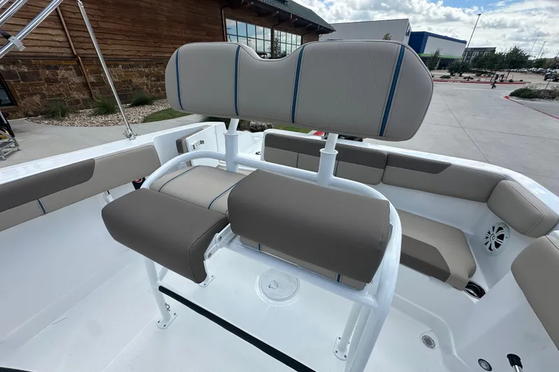 Slide: The Image of 2027 Tahoe 2150 CC boat interior with cushioned seating and modern design. - 16