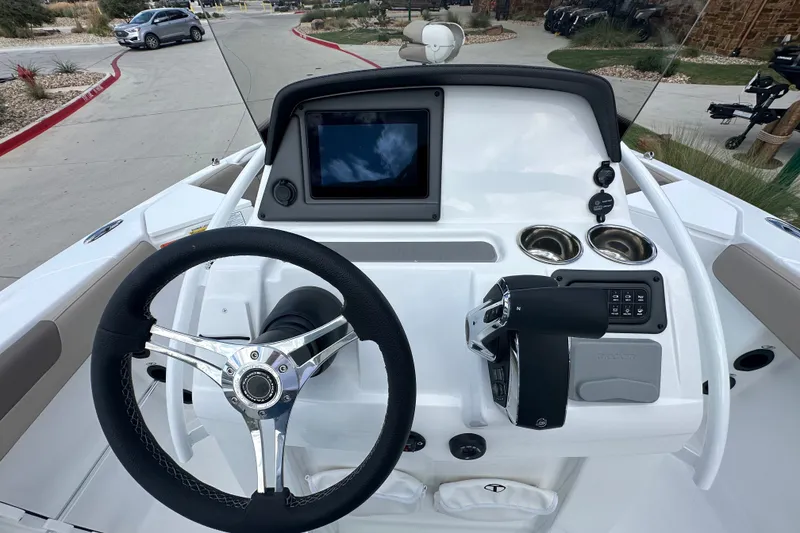Slide: The Image of Steering console of 2027 Tahoe 2150 CC boat with touchscreen and controls. - 17