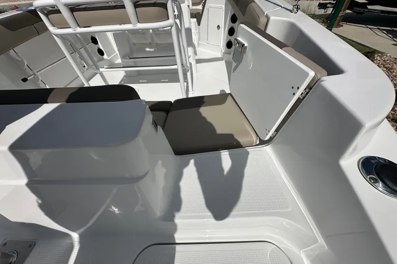 Slide: The Image of 2027 Tahoe 2150 CC boat interior with open storage compartment and seating. - 14