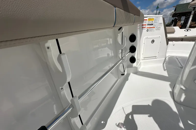 Slide: The Image of Interior view of 2027 Tahoe 2150 CC boat, featuring rod holders and seating area. - 26