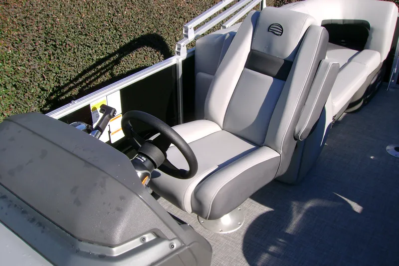 Slide: The Image of 2027 Sun Tracker Party Barge 22 XP3 interior with steering wheel and seating. - 15