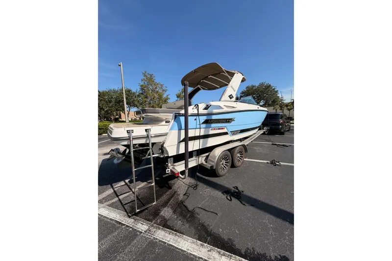 Slide: The Image of 2024 MONTERY 278ss boat on trailer in parking lot, sunny day. - 23
