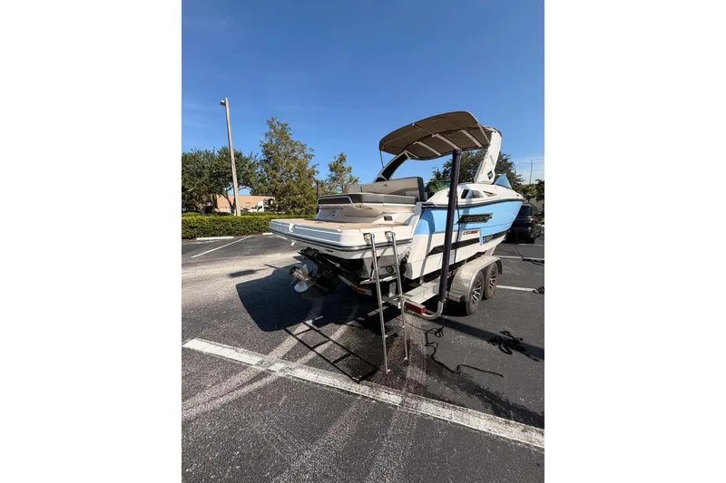 The Image of 2024 MONTERY 278ss boat on trailer in parking lot under clear blue sky. - 0