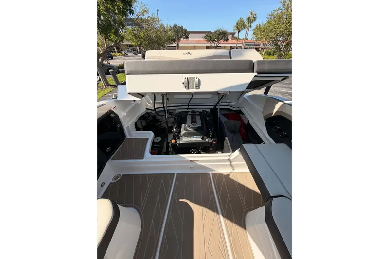 Slide: The Image of 2024 MONTERY 278ss boat engine compartment with open hatch, showcasing interior details. - 20