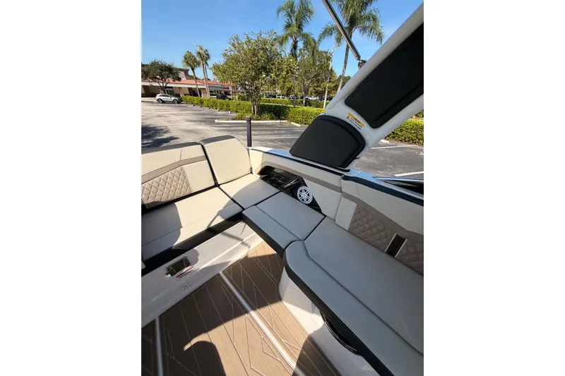 Slide: The Image of 2024 MONTERY 278ss boat interior with beige seating and modern design. - 17