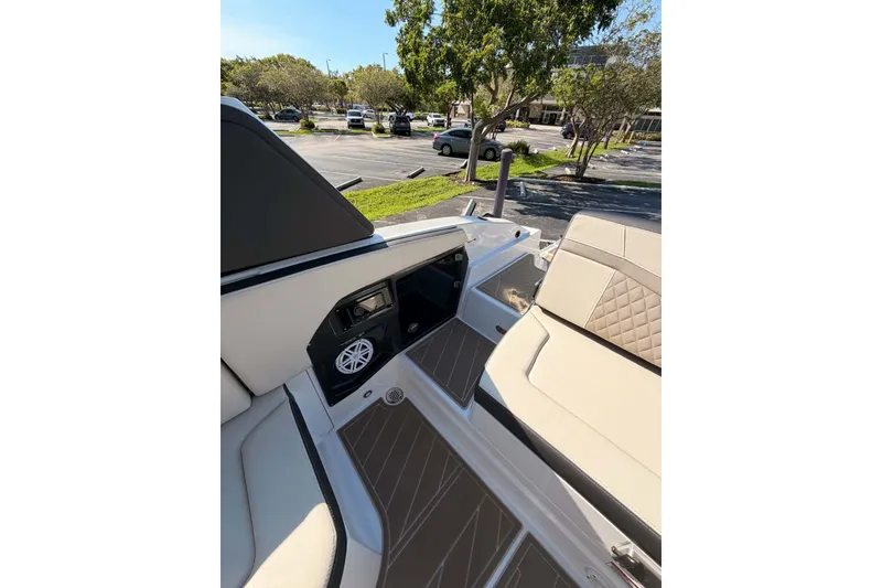 Slide: The Image of 2024 MONTERY 278ss boat interior with beige seating and speaker system. - 16
