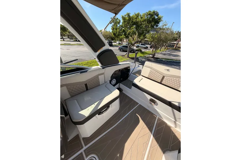 Slide: The Image of 2024 MONTERY 278ss boat interior with beige seating and modern design. - 18