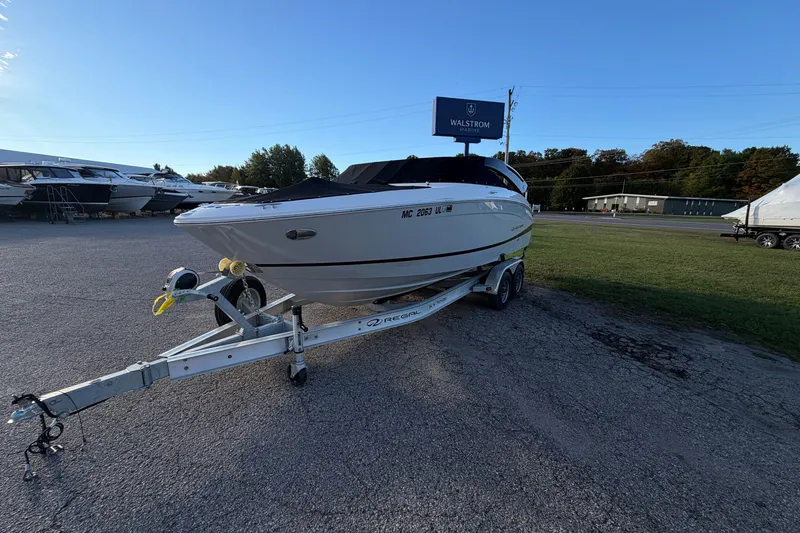 Slide: The Image of 2020 Regal LS4 boat on trailer at Walstrom Marine dealership. - 17