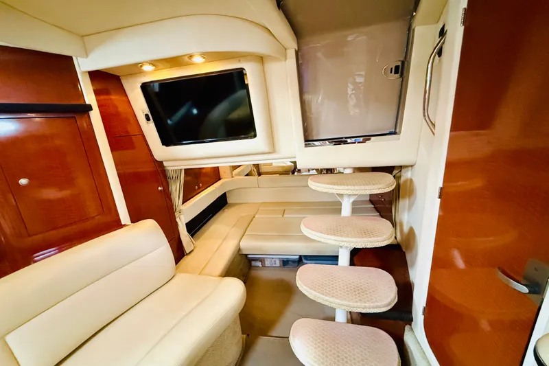 Slide: The Image of Luxurious interior of a 2005 Sea Ray 340 Sundancer yacht with plush seating and modern amenities. - 42