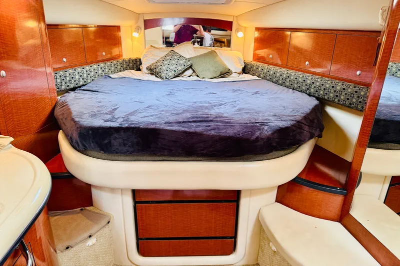 Slide: The Image of Luxurious cabin interior of 2005 Sea Ray 340 Sundancer yacht with cozy bedding. - 63