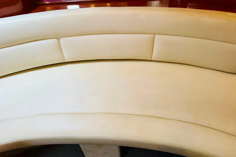 Slide: The Image of Cream leather seating on 2005 Sea Ray 340 Sundancer yacht interior. - 50