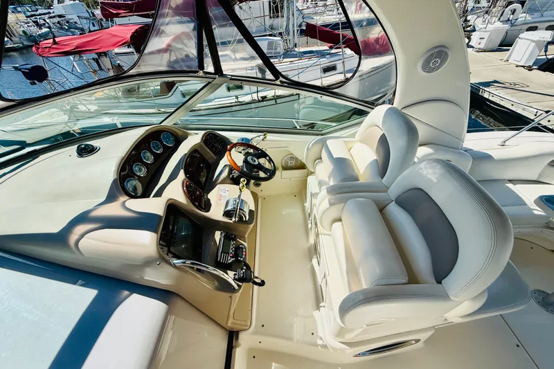 Slide: The Image of Cockpit of 2005 Sea Ray 340 Sundancer with dual seats and control panel. - 21