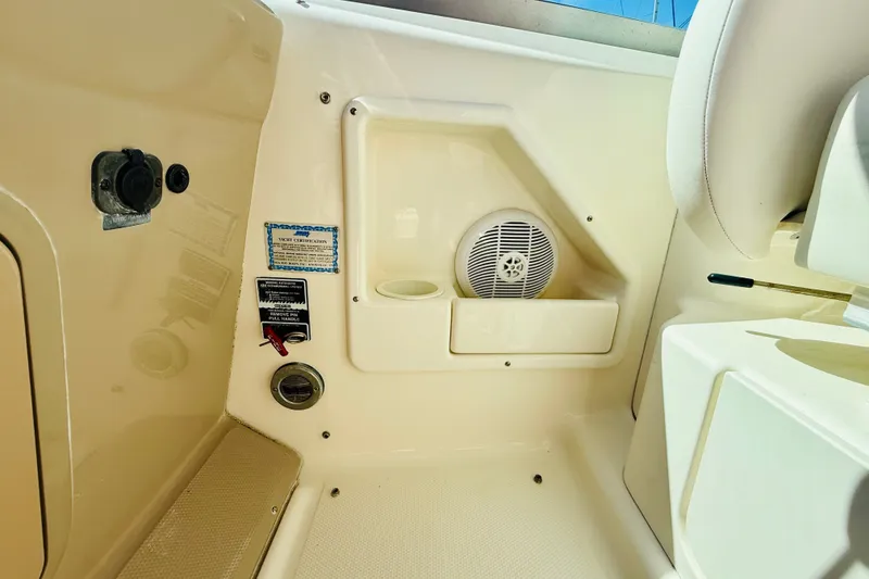 Slide: The Image of 2005 Sea Ray 340 Sundancer interior with speaker and yacht certification label. - 32