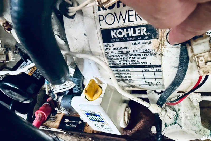 Slide: The Image of Engine compartment of a 2005 Sea Ray 340 Sundancer with Kohler generator label. - 71