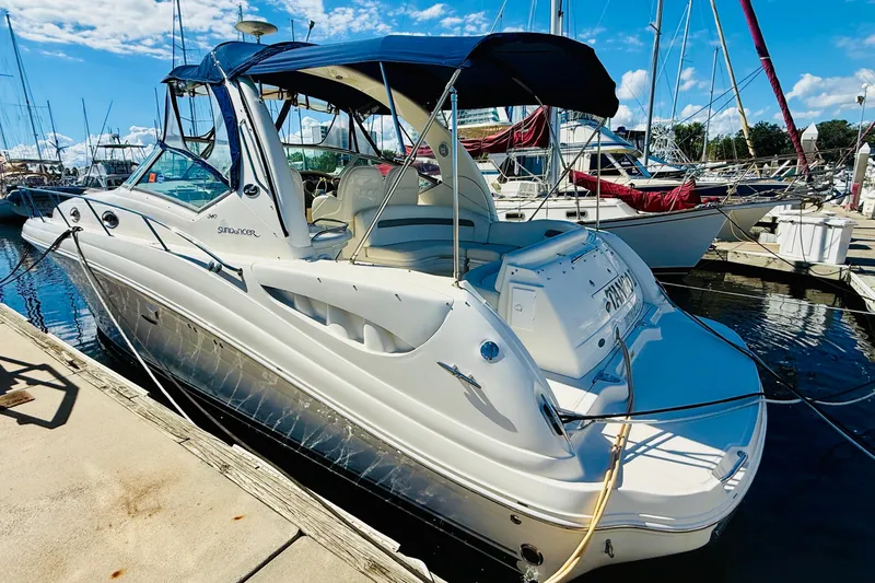 Slide: The Image of 2005 Sea Ray 340 Sundancer docked at marina under clear blue sky. - 2