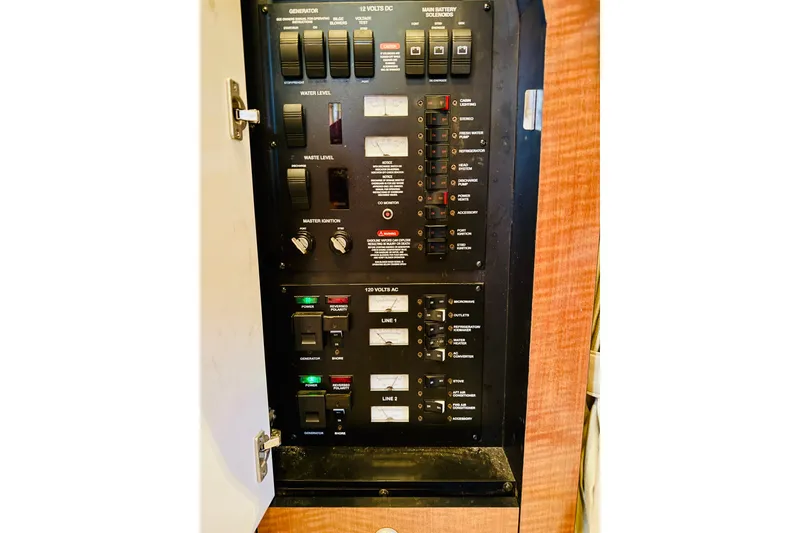 Slide: The Image of Electrical control panel on a 2005 Sea Ray 340 Sundancer boat. - 75