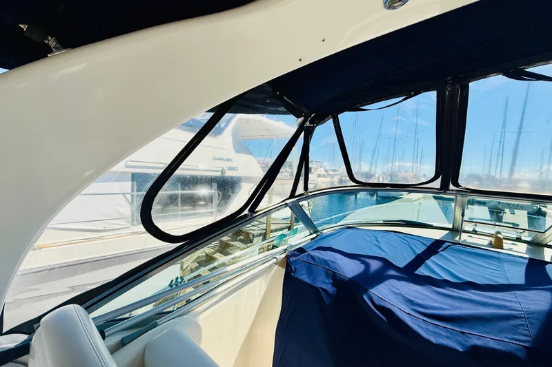 Slide: The Image of Interior view of a 2005 Sea Ray 340 Sundancer yacht with marina backdrop. - 39