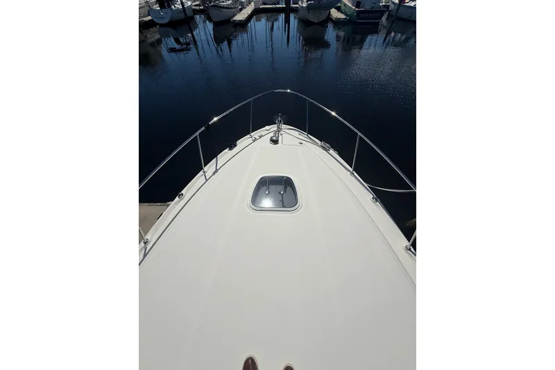 Slide: The Image of Bow view of 2005 Sea Ray 340 Sundancer yacht docked at marina. - 10