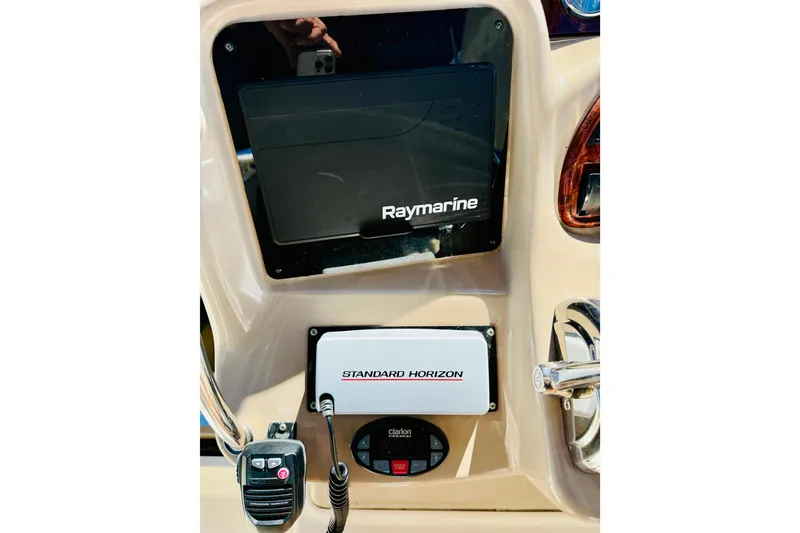 Slide: The Image of Control panel of 2005 Sea Ray 340 Sundancer with Raymarine and Standard Horizon equipment. - 19