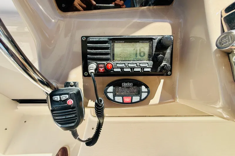 Slide: The Image of Control panel of a 2005 Sea Ray 340 Sundancer with radio and Clarion audio system. - 20