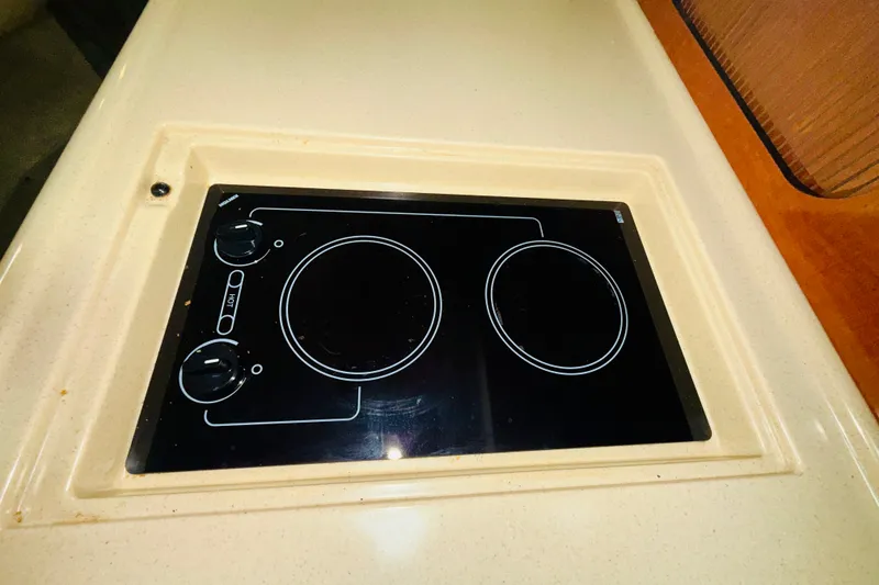 Slide: The Image of Built-in stovetop on 2005 Sea Ray 340 Sundancer yacht kitchen counter. - 54