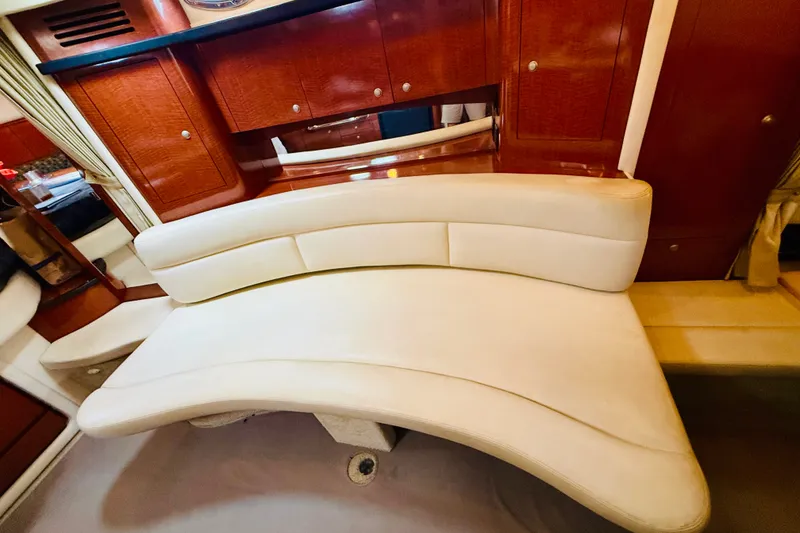 Slide: The Image of Luxurious interior seating of 2005 Sea Ray 340 Sundancer yacht with elegant wood cabinetry. - 49