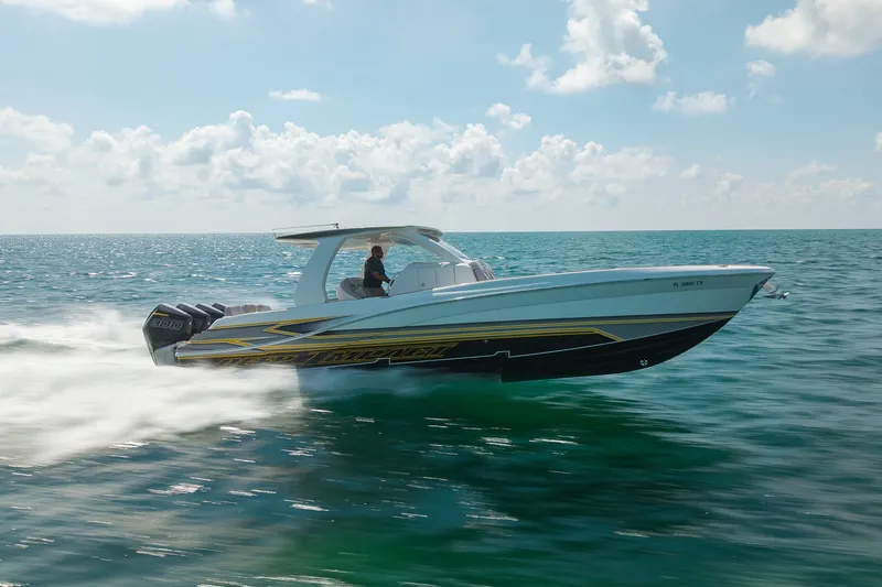 Slide: The Image of 2025 Deep Impact 369 Sport boat speeding on open water under a clear sky. - 7