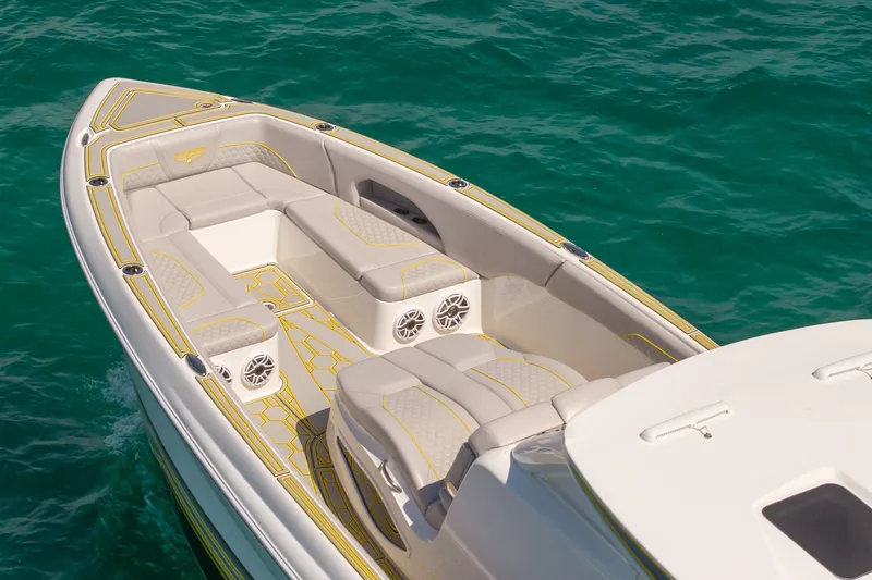 Slide: The Image of 2025 Deep Impact 369 Sport boat with luxurious seating on turquoise water. - 10