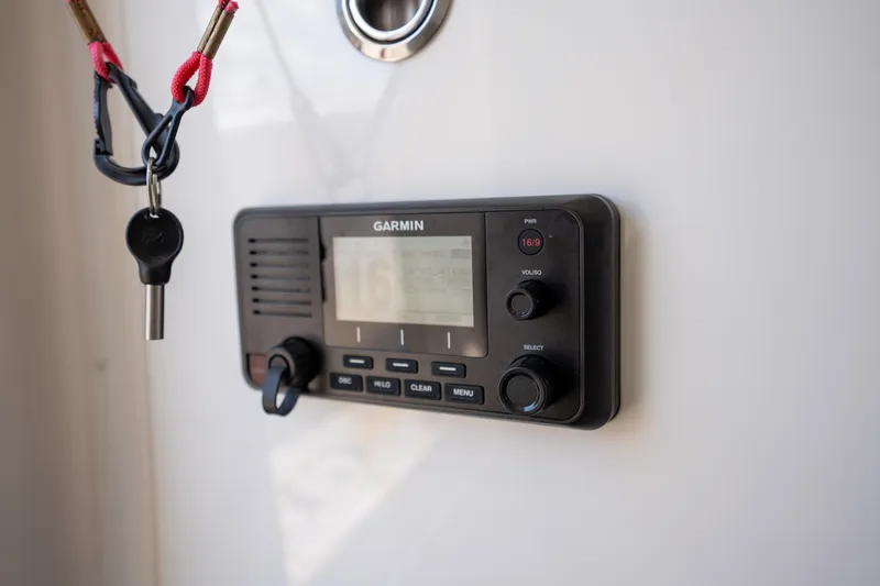 Slide: The Image of Garmin marine radio on 2025 Deep Impact 369 Sport boat dashboard. - 25
