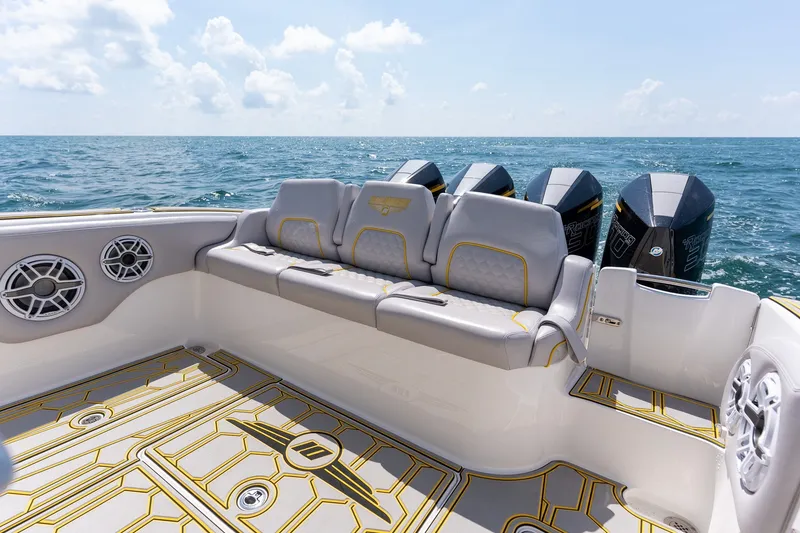 Slide: The Image of Luxury seating on 2025 Deep Impact 369 Sport boat with powerful engines, ocean backdrop. - 15