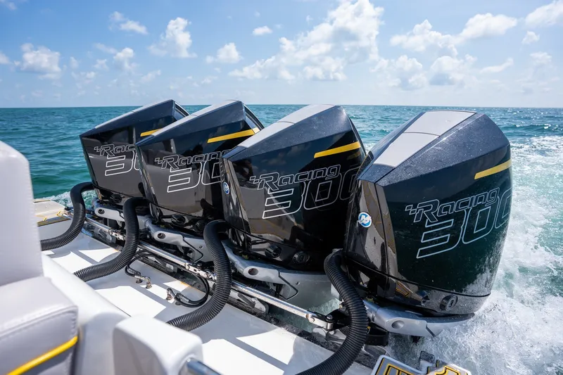 Slide: The Image of Triple Mercury Racing 300 outboard engines on a 2025 Deep Impact 369 Sport boat. - 18