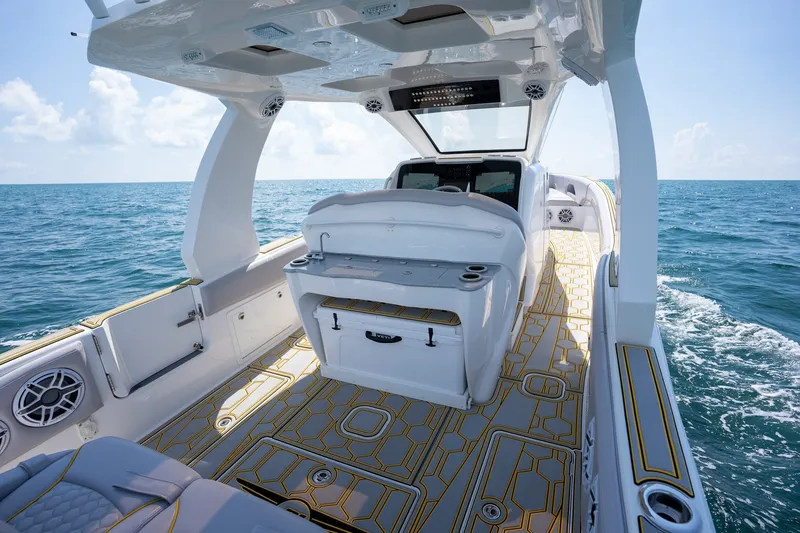Slide: The Image of 2025 Deep Impact 369 Sport boat interior on open sea, showcasing luxury design and features. - 16