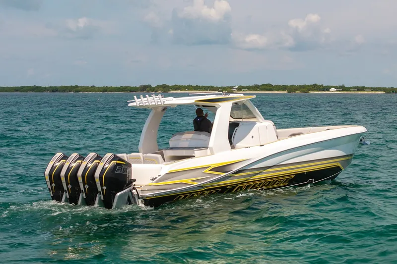 Slide: The Image of 2025 Deep Impact 369 Sport boat with quad engines cruising on open water. - 1