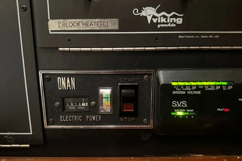 Slide: The Image of Control panel of a 1990 Viking 44 Motor Yacht with Onan electric power system. - 41