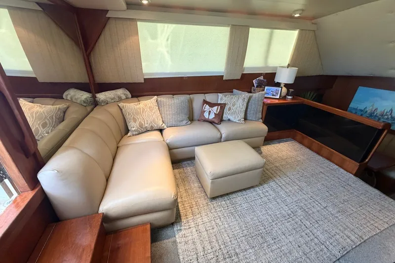 Slide: The Image of Luxurious interior of 1990 Viking 44 Motor Yacht with beige leather seating and decor. - 30