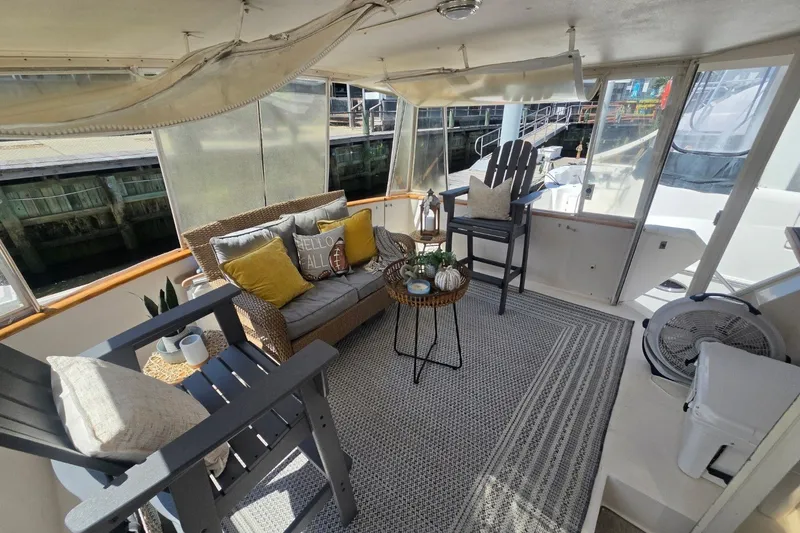 Slide: The Image of Cozy interior of 1990 Viking 44 Motor Yacht with seating and decor. - 18