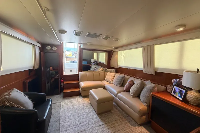 Slide: The Image of Luxurious interior of a 1990 Viking 44 Motor Yacht with comfortable seating and elegant decor. - 35